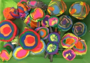 aerial photo of multicoloured arts and crafts made by members of Z-artists