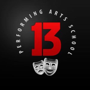 13 performing arts school logo. Large red number 13 with comedy and tragedy theatre masks below